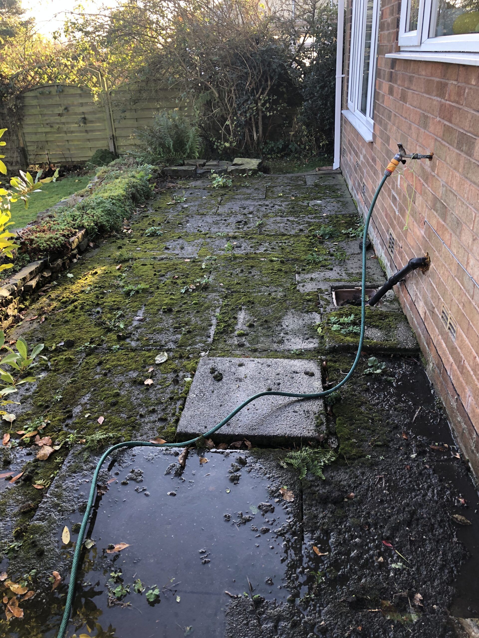 Patio pressure washing before cleaning